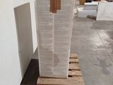 a large stack of boxes on a pallet in a warehouse