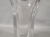 a glass vase that is sitting on a table
