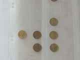 a lot of coins in a plastic bag on a table