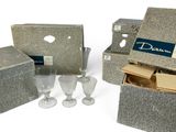 three boxes with wine glasses and a wine glass in them