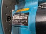 a close up of a blue machine with a label on it