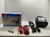 a box of wires and a charger on a table