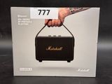 a box with a picture of a hand holding a speaker