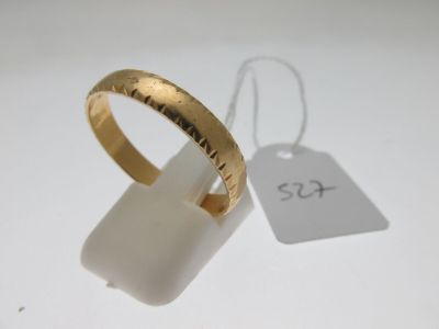 a close up of a gold ring with a price tag on it