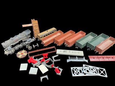 many different types of toy trains on a black background