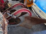many different types of old cars parked in a garage