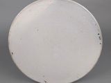 an image of a white plate on a gray background
