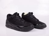 a pair of black sneakers on a white background