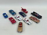 several toy cars are arranged in a circle on a white surface
