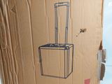 a cardboard box with a drawing of a suitcase on it