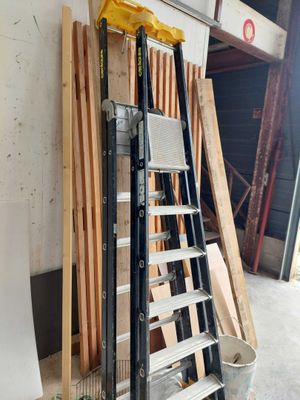 a ladder that is leaning against a wall in a garage
