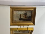 a picture of a clock with a picture of a boat on it