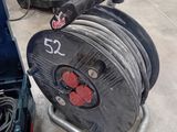 an image of a cart with a large reel on it