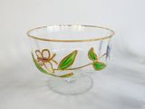 a glass bowl with a floral design on it