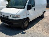 a white van that is parked in a parking lot
