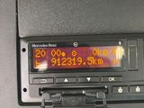 a digital clock on the dashboard of a car