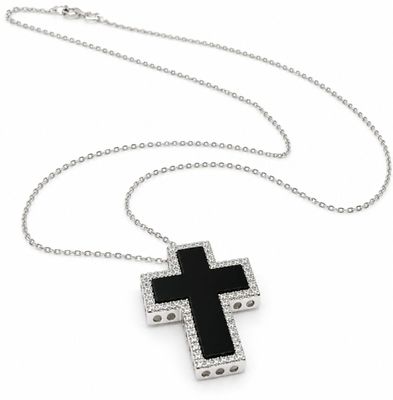 an image of a black and white cross pendant on a silver chain