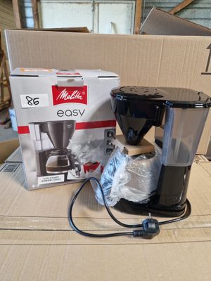 a box with a coffee maker on it and a box with a coffee maker on it