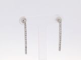 paire de boucles d'oreilles créoles en or blanc serties de diamants