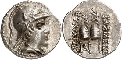 a silver coin with an image of a woman and a man on it