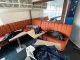 a couch and a table in the corner of a room