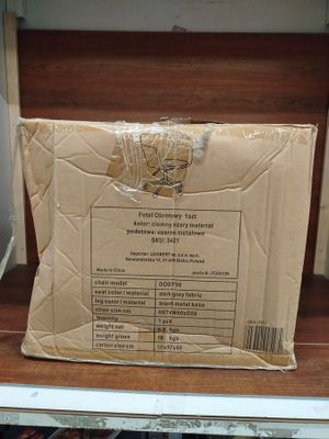 a cardboard box sitting on top of a shelf in a store
