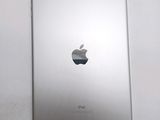 an apple ipad sitting on top of a white table next to a white wall