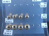 a display case with a lot of metal beads on it