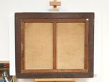 a picture of a painting on a easel with a cross above it