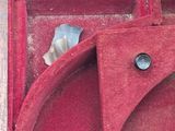 a red box that has a heart shaped object inside of it