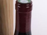 a bottle of wine sitting next to a bottle of wine