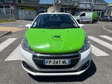 a green car that is parked in the parking lot