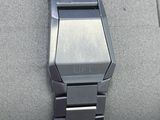 wrist of a watch in a display case with a watch on it