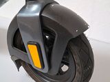 a scooter that is sitting on a white surface