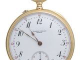 an image of a close up of a pocket watch on a white background