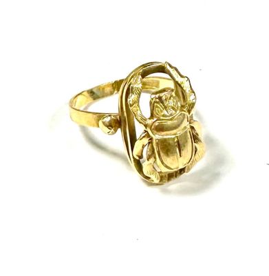gold plated ring with a scarabus design on the front