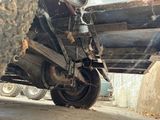 a close up of a truck with a tire on it ' s side