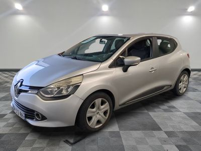 the silver car is parked on a checkered tile floor