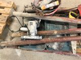 a pile of tools sitting on the floor next to a pallet