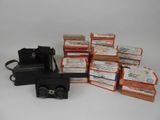 many boxes of food and a camera on the table