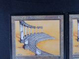 two cards on the table with a picture of a bridge