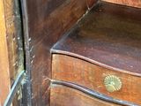 a wooden bench with a drawer on the bottom of it