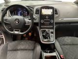 a picture of a car dashboard with a steering wheel and dashboard controls