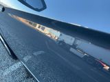 a reflection of a truck in the side mirror of a car