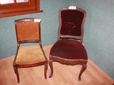 two chairs sitting next to each other in a room