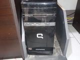 a computer that is sitting on a stand in the room