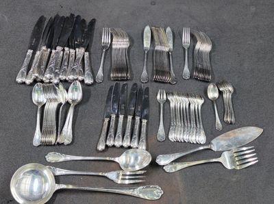 a lot of forks and spoons that are on the table