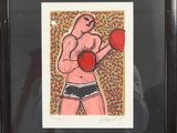 painting of a man with boxing gloves in a black frame