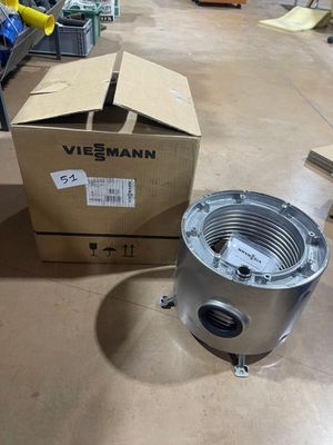 a box and a metal object sitting on the floor