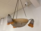 a light hanging from the ceiling in a room
